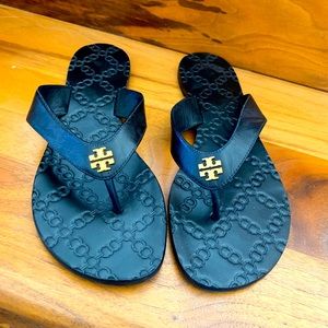 Tory Burch monogram black leather flip flops
